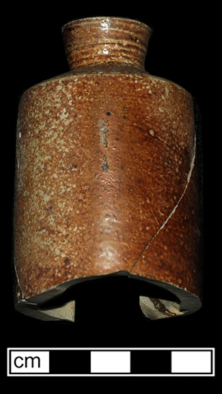 Buff bodied salt glaze stoneware bottle with iron wash. Possible ink bottle. Rim diameter: 0.56”, Vessel V-25 from 18MO609.